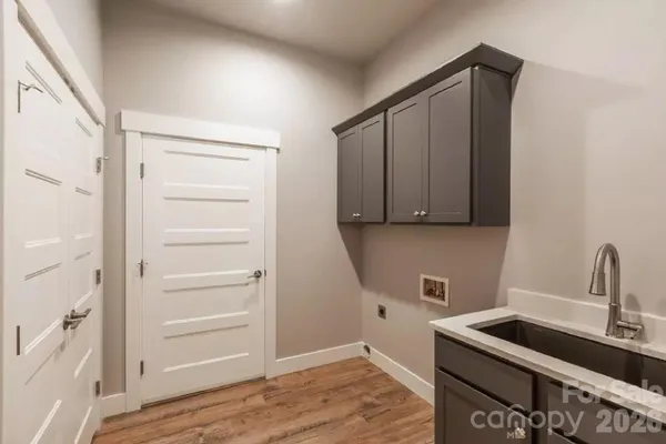 a kitchen with a sink and cabinets