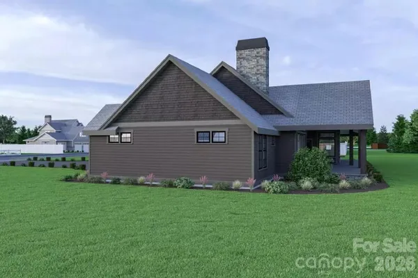 a front view of a house with a garden and plants