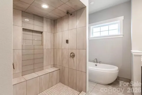 a bathroom with a bathtub and toilet