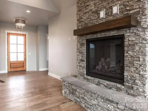 a room with fireplace and wooden floor