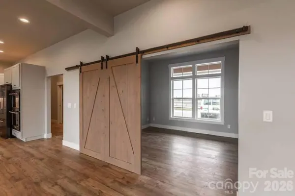 a view of a room with wooden floor and walls