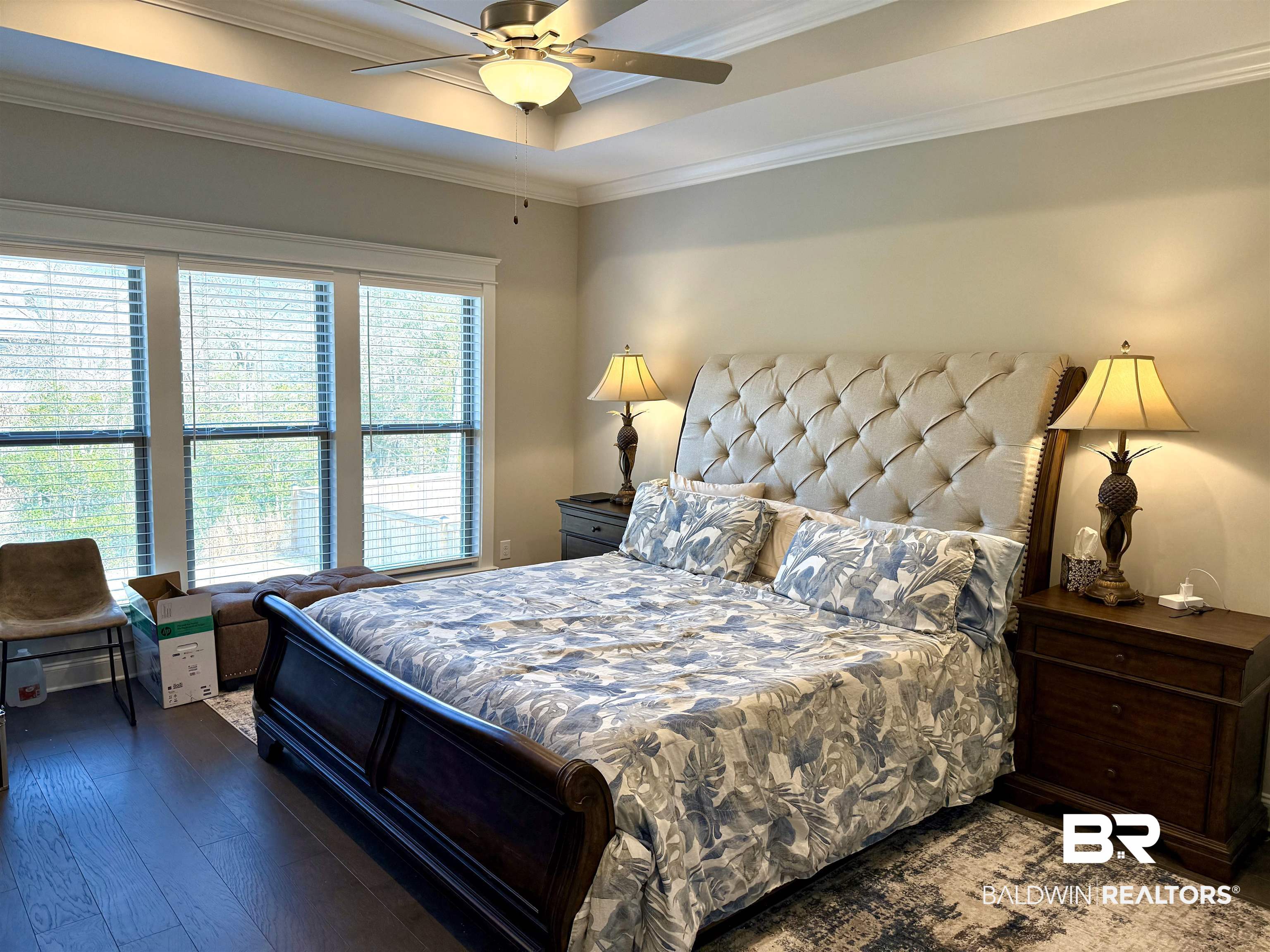 31748 Canopy Loop Spanish Fort, AL 36527 - Photo 8 of 22 Bedroom featuring ceiling fan, ornamental molding, dark hardwood / wood-style flooring, and a raised ceiling