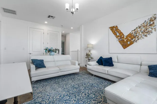 a bedroom with a bed and closet with wooden floor