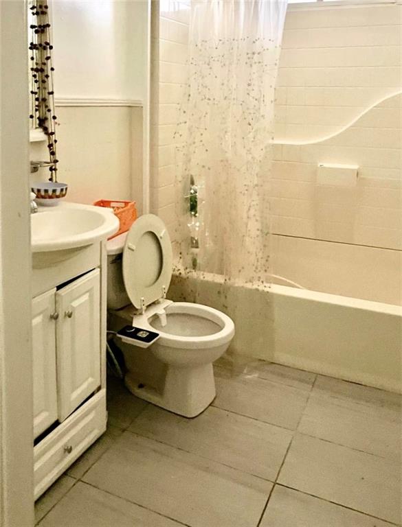 1443 Oxford Road Northeast, Unit 2 Atlanta, GA 30307 - Photo 7 of 7 a bathroom with a sink toilet and shower