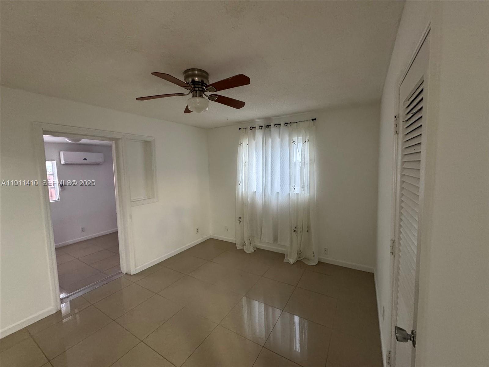 4578 Northwest 16th Avenue, Unit 4578 Tamarac, FL 33309 - Photo 13 of 24 a view of empty room with windows