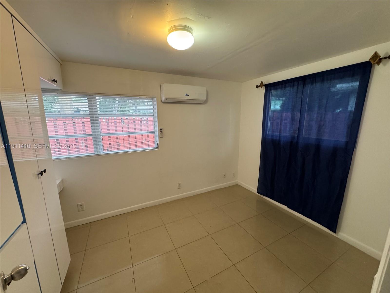 4578 Northwest 16th Avenue, Unit 4578 Tamarac, FL 33309 - Photo 15 of 24 an empty room with windows