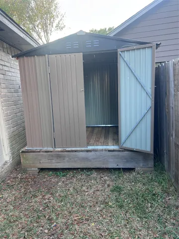 a wooden door in a backyard