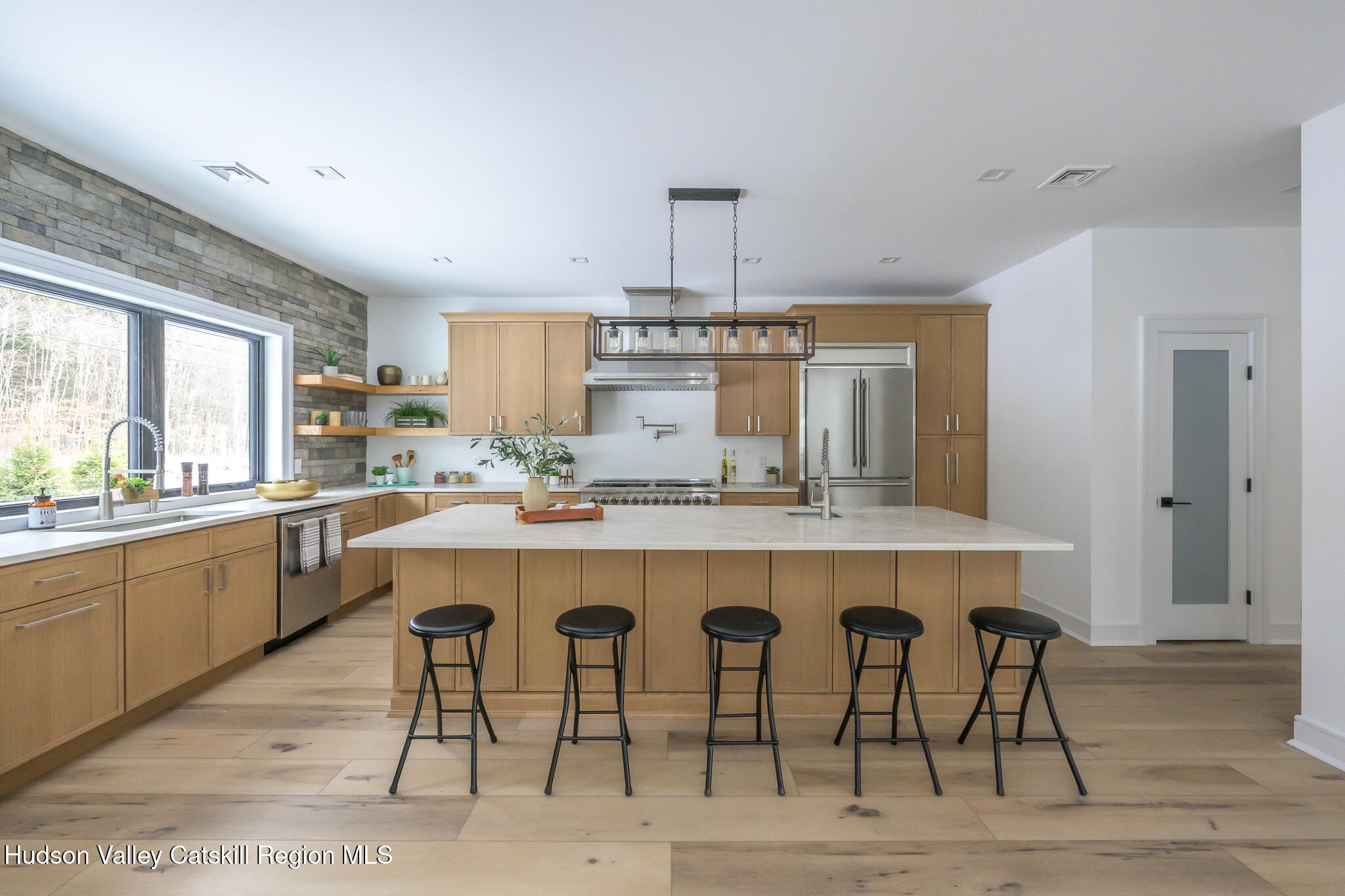 305 Mitchell Hollow Road Windham, NY 12496 - Photo 12 of 39 a kitchen with a table and chairs in it