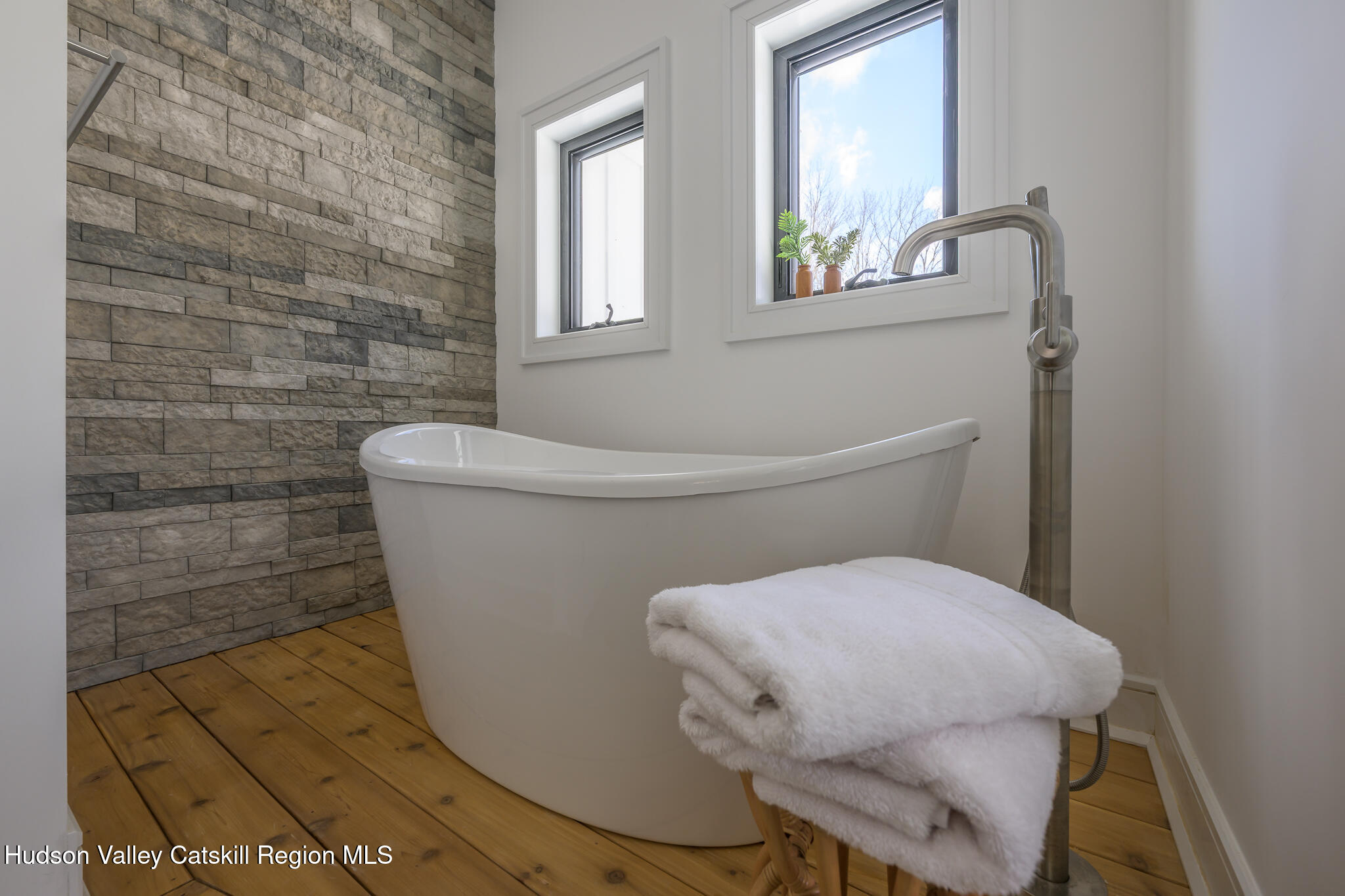 305 Mitchell Hollow Road Windham, NY 12496 - Photo 19 of 39 a bathroom with a sink and mirror