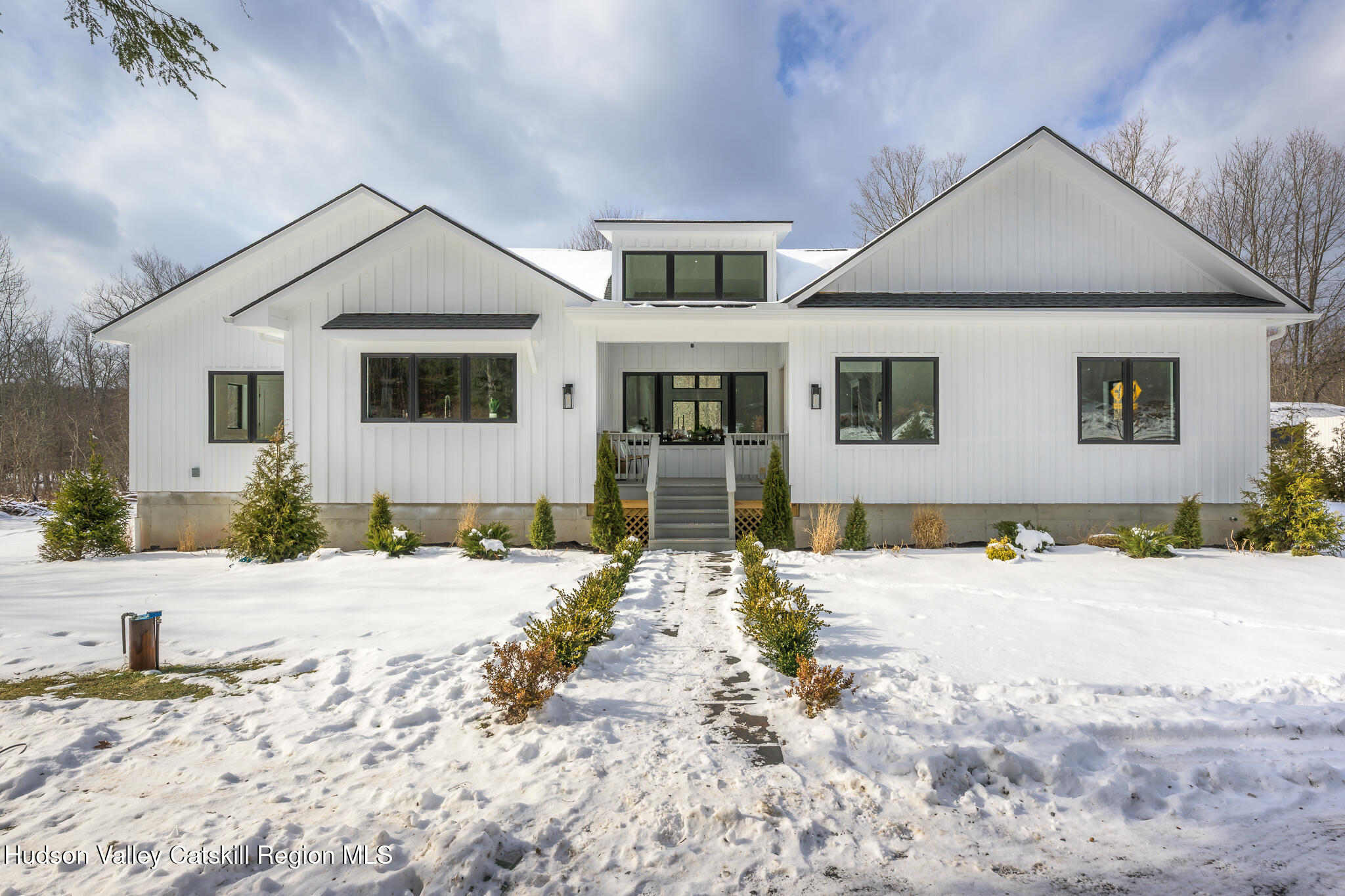305 Mitchell Hollow Road Windham, NY 12496 - Photo 2 of 39 a front view of a house with a yard
