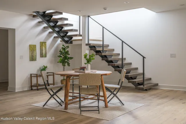 a view of a livingroom with furniture and a potted plant