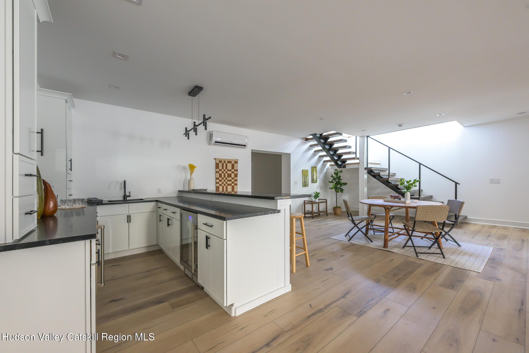305 Mitchell Hollow Road Windham, NY 12496 - Photo 26 of 39 a kitchen with sink cabinets and wooden floor