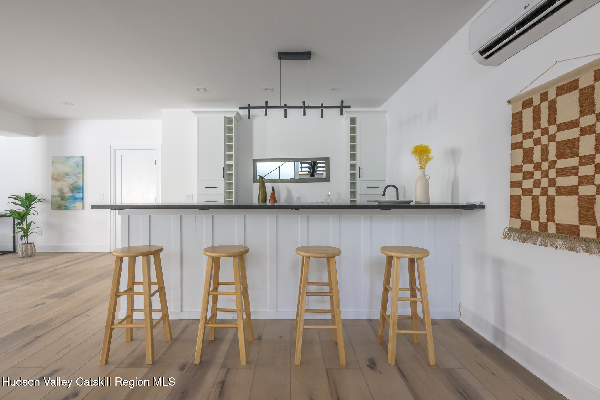 305 Mitchell Hollow Road Windham, NY 12496 - Photo 28 of 39 a kitchen with stainless steel appliances kitchen island granite countertop a table and chairs