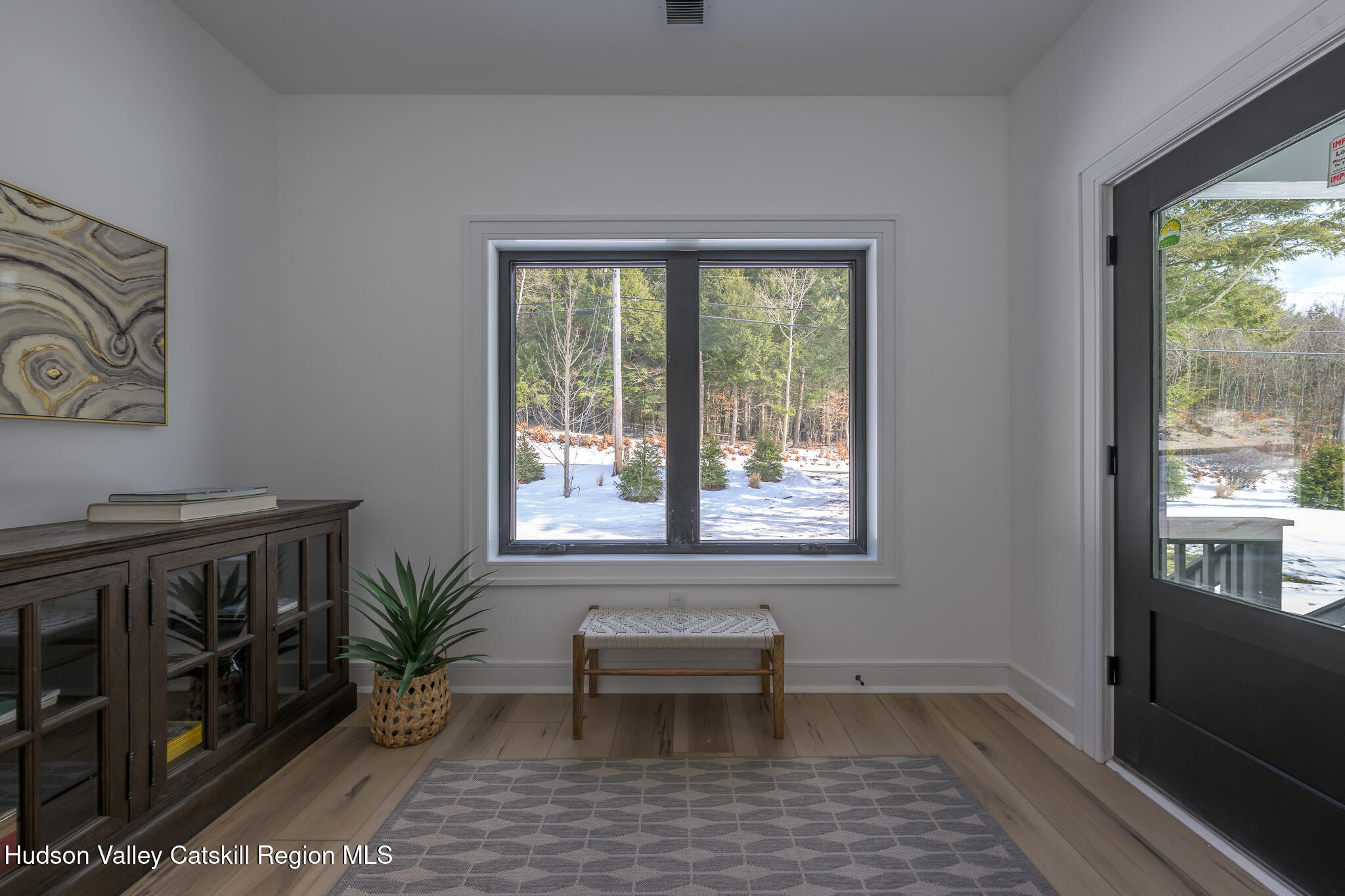 305 Mitchell Hollow Road Windham, NY 12496 - Photo 6 of 39 a view of a room that has a window and wooden floor
