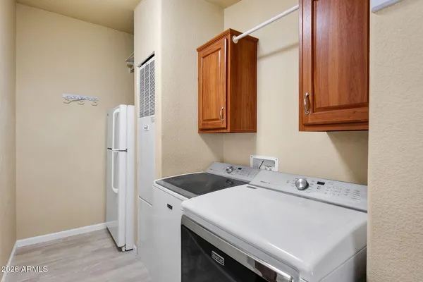 a utility room with dryer and washer