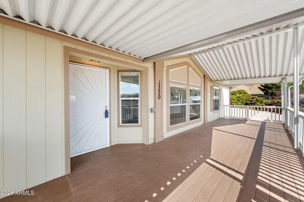 a view of a living room and a balcony