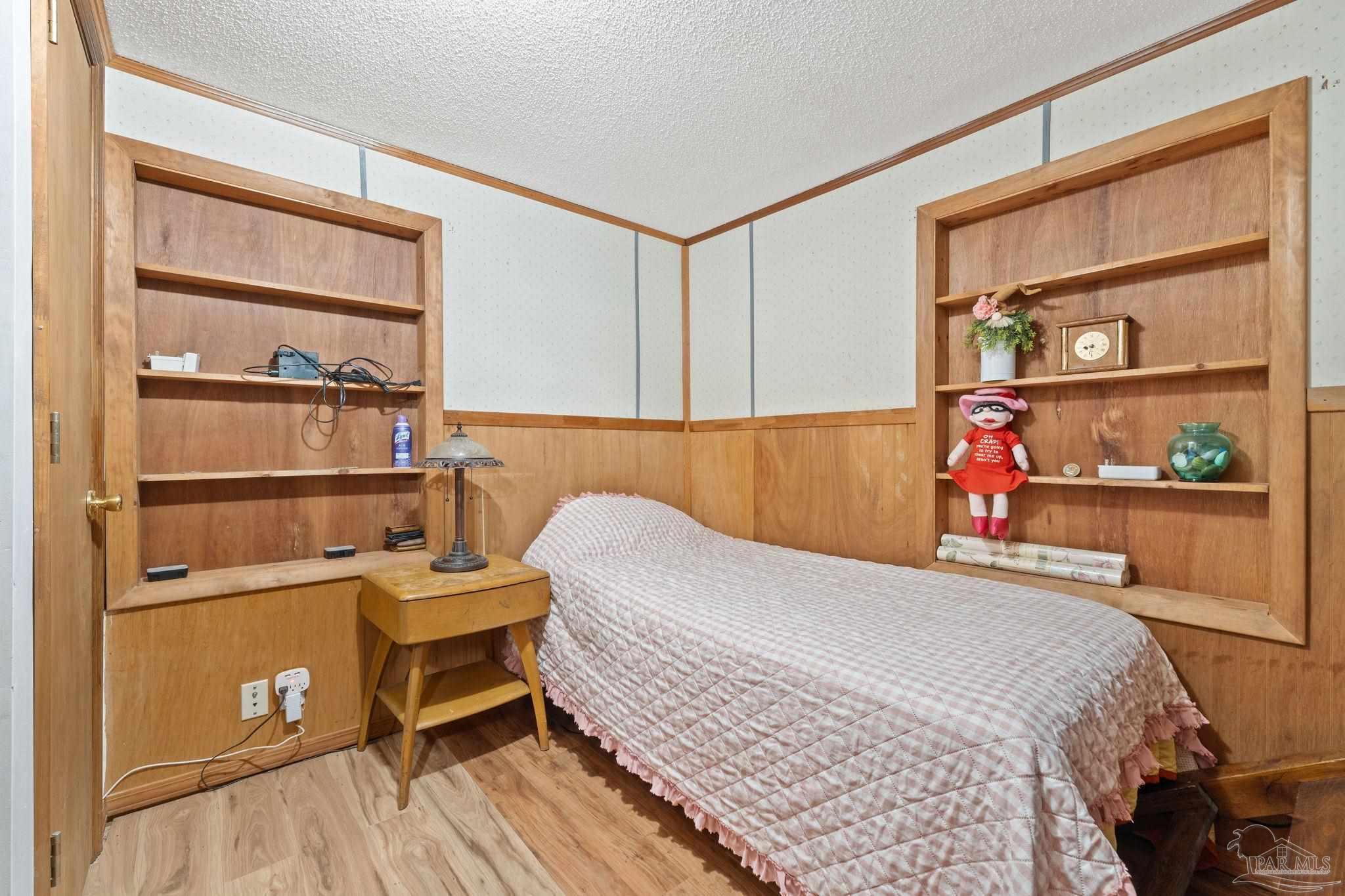 3319 Bob Tolbert Road Navarre, FL 32566 - Photo 25 of 51 a bed room with a bed and a closet