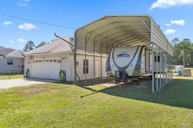 a view of a house with basketball court