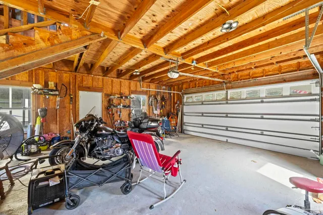 a view of a garage with rack and bicycle