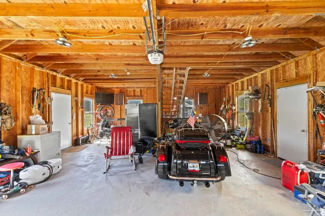 a view of a chair and table in the backyard