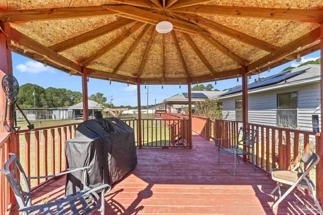 an outdoor space with furniture and garden view