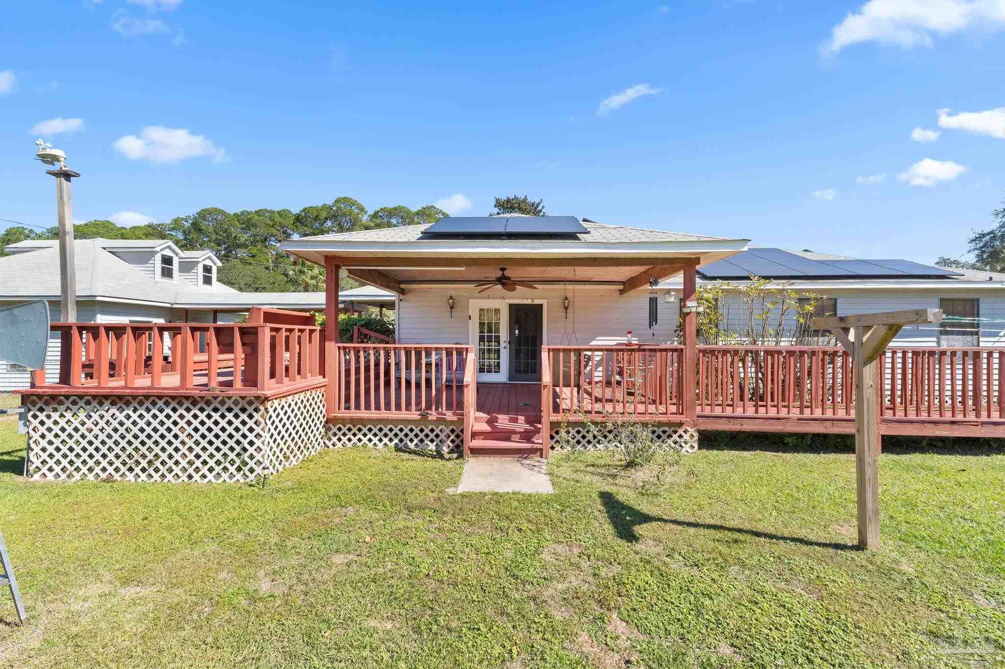 3319 Bob Tolbert Road Navarre, FL 32566 - Photo 35 of 51 a view of a house with a yard