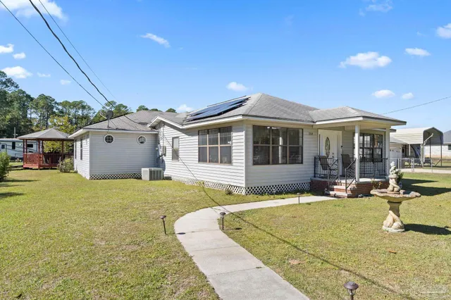 a front view of a house with swimming pool