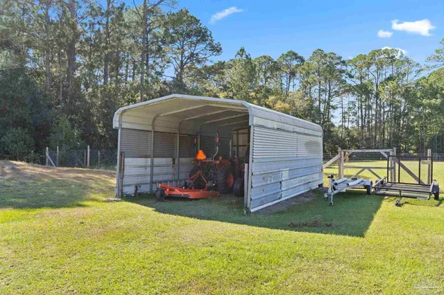 an aerial view of a house with outdoor space