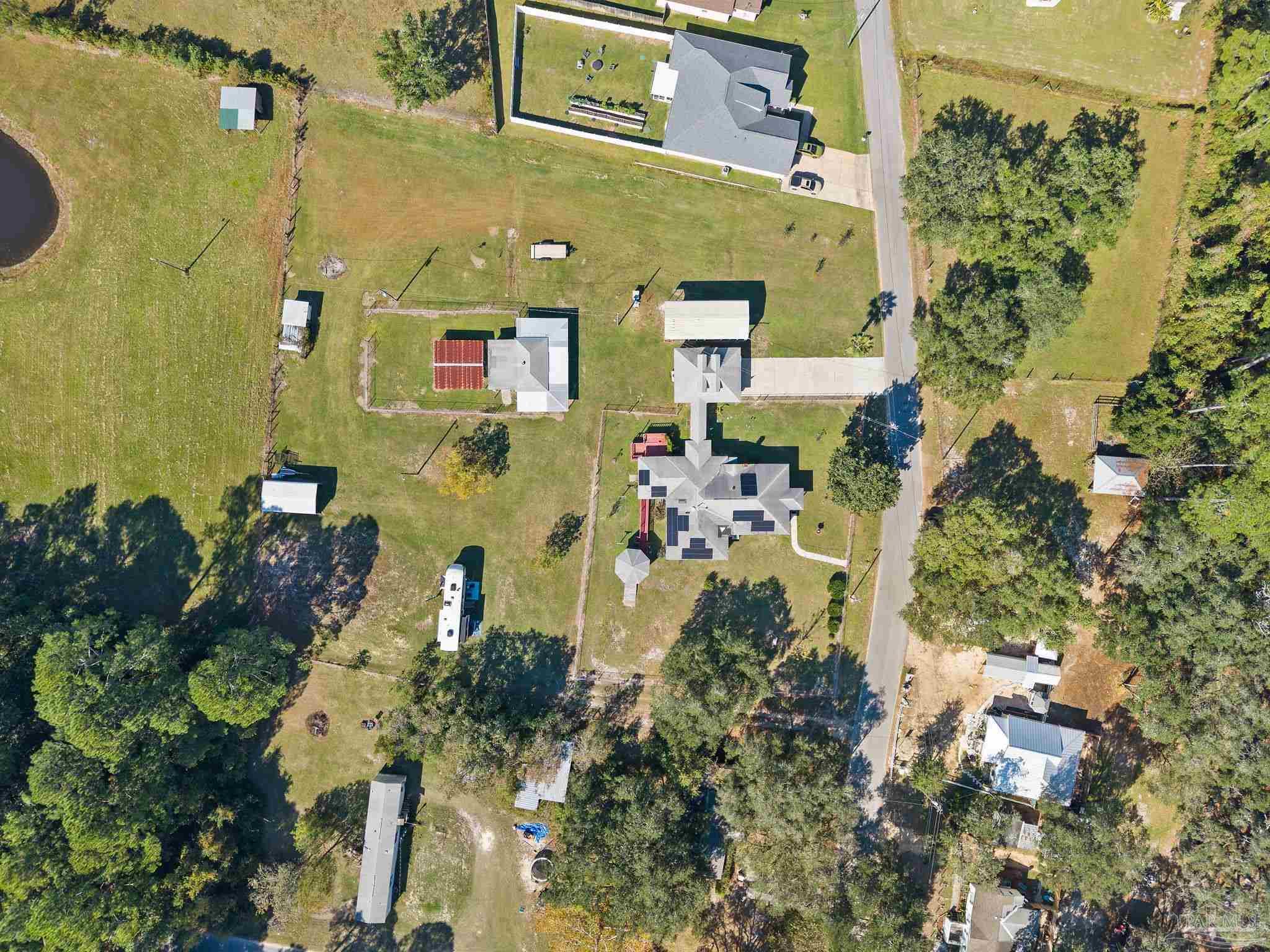 3319 Bob Tolbert Road Navarre, FL 32566 - Photo 46 of 51 an aerial view of residential houses with outdoor space