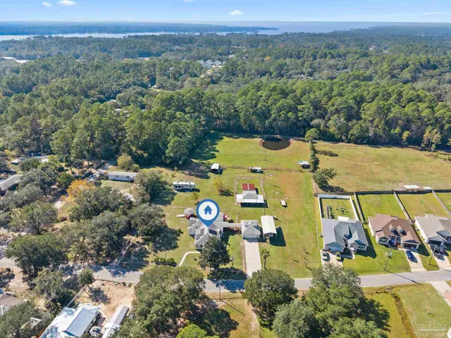 an aerial view of residential houses with outdoor space