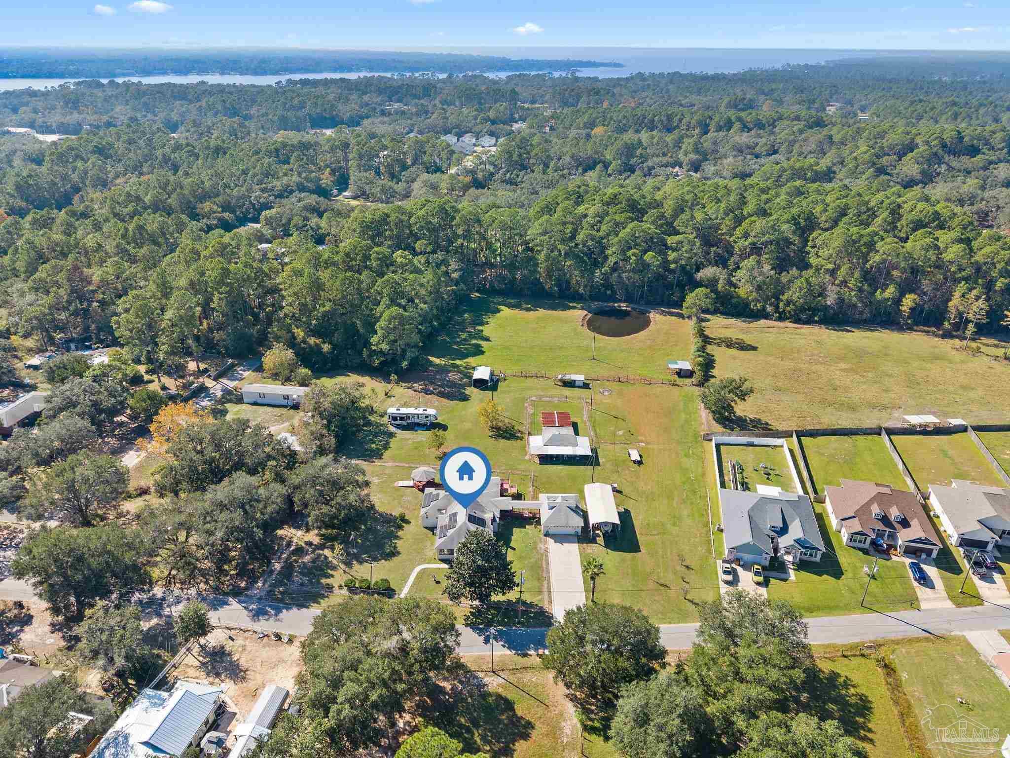 3319 Bob Tolbert Road Navarre, FL 32566 - Photo 47 of 51 an aerial view of a house with a yard