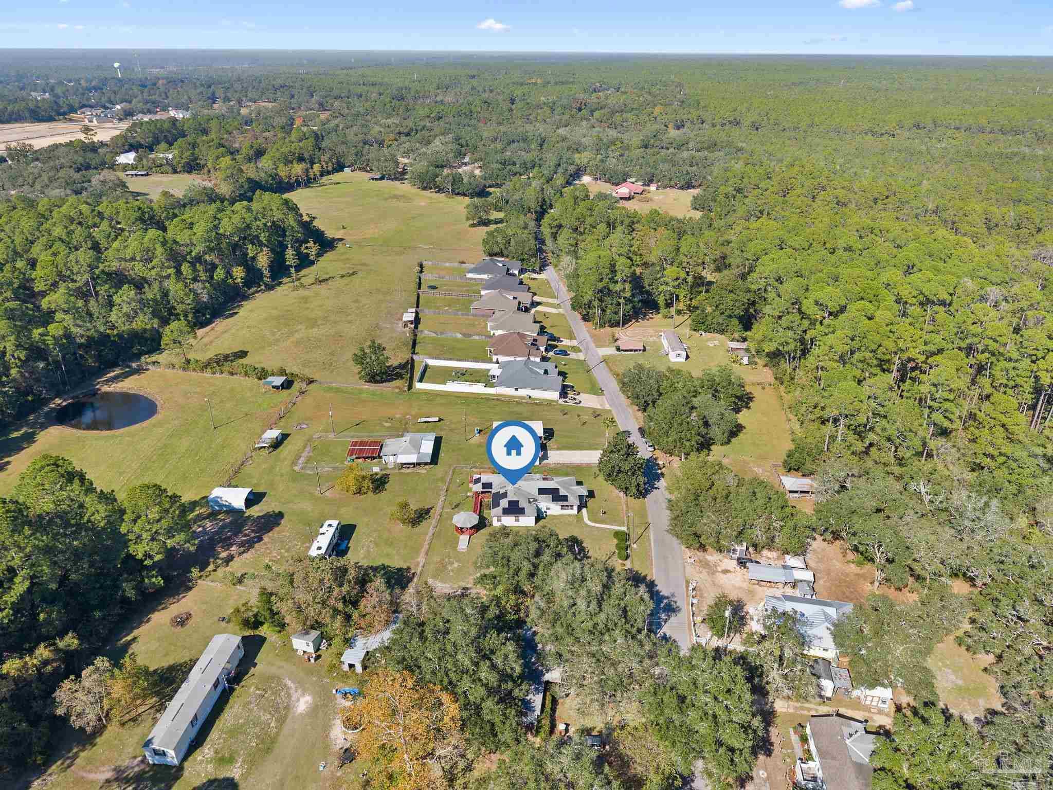 3319 Bob Tolbert Road Navarre, FL 32566 - Photo 48 of 51 an aerial view of residential houses with outdoor space