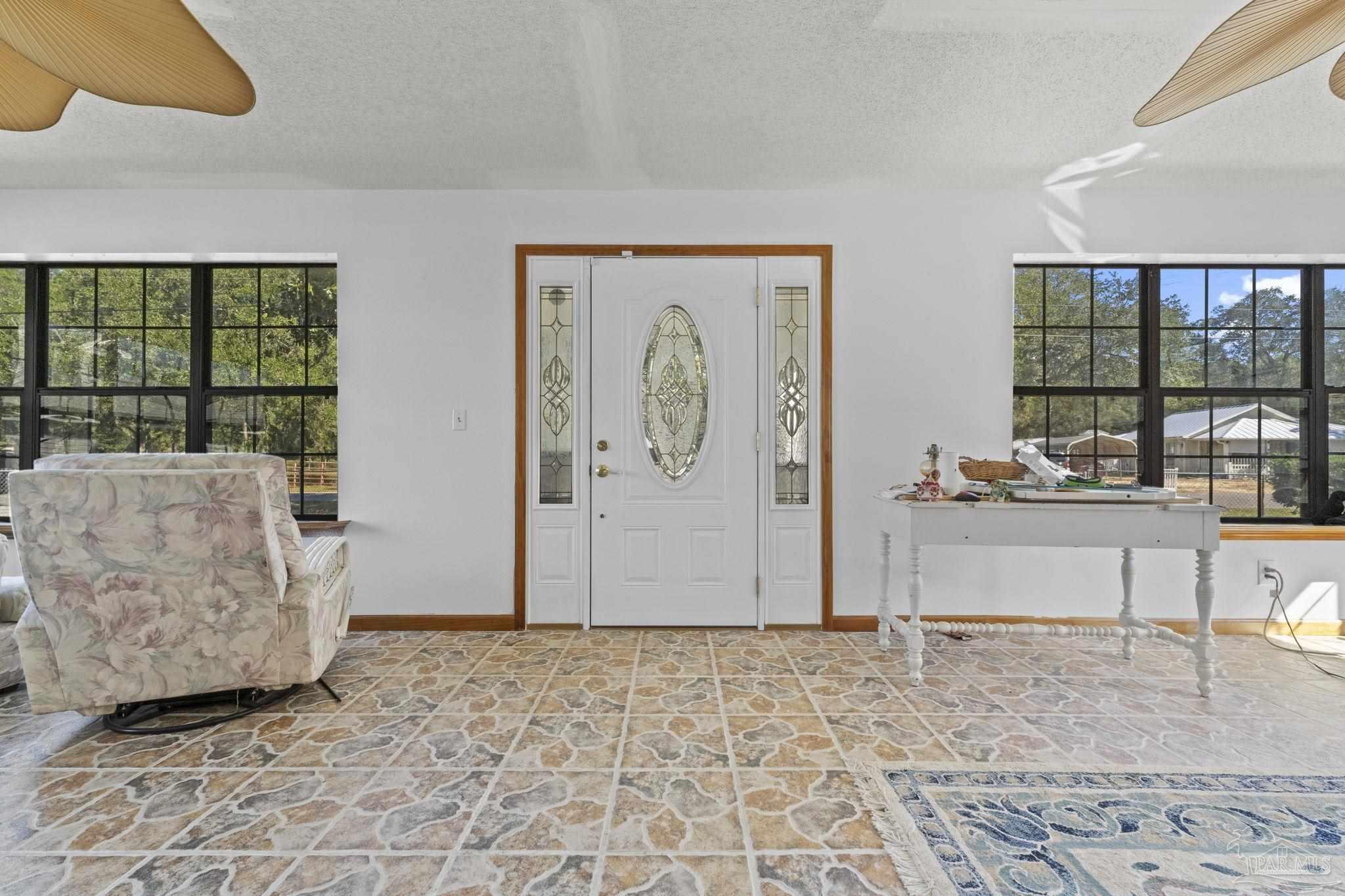 3319 Bob Tolbert Road Navarre, FL 32566 - Photo 5 of 51 a living room with furniture
