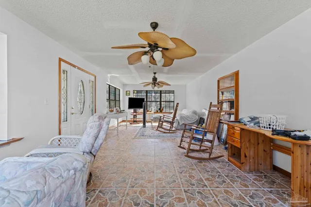 a bedroom with furniture and a chandelier
