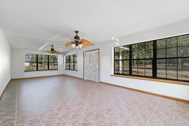 a view of a big room with windows