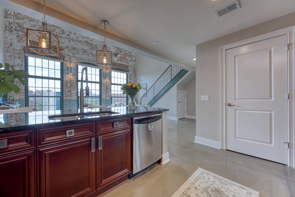 1201 Front Avenue, Unit 522 Columbus, GA 31901 - Photo 11 of 56 a kitchen with a sink and cabinets