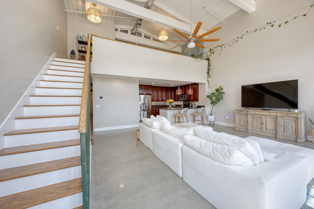 1201 Front Avenue, Unit 522 Columbus, GA 31901 - Photo 21 of 56 a living room with furniture and a flat screen tv