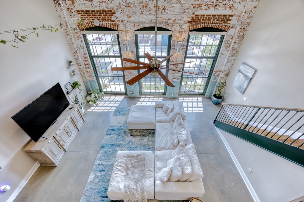 1201 Front Avenue, Unit 522 Columbus, GA 31901 - Photo 23 of 56 a living room with furniture and a flat screen tv