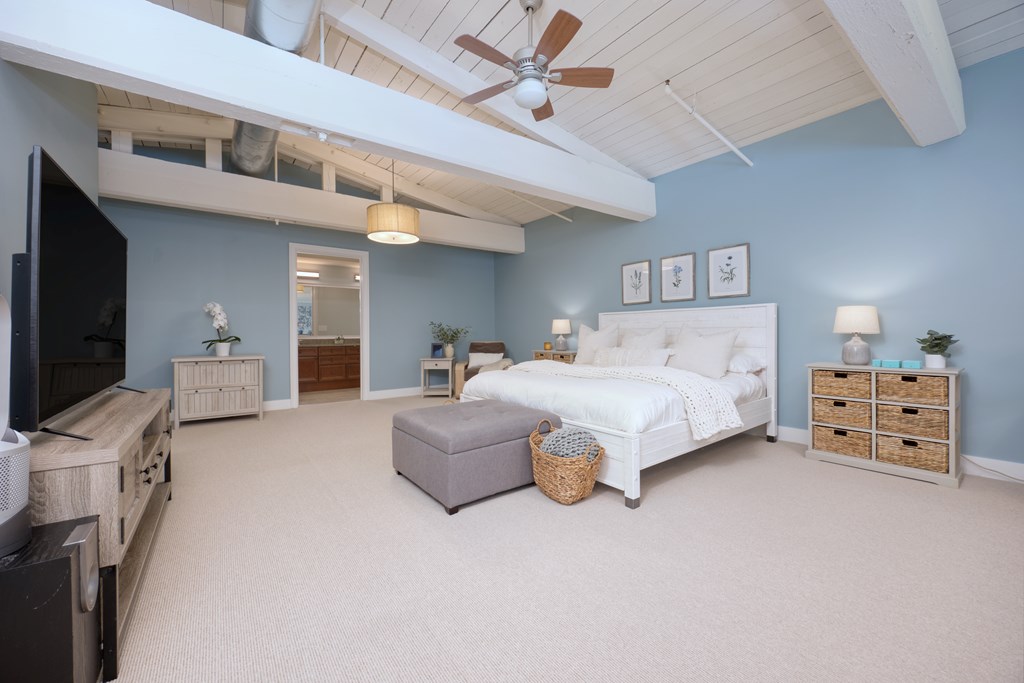 1201 Front Avenue, Unit 522 Columbus, GA 31901 - Photo 24 of 56 a bedroom with furniture and a flat tv screen