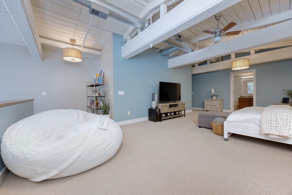 1201 Front Avenue, Unit 522 Columbus, GA 31901 - Photo 25 of 56 a living room with furniture and a flat screen tv