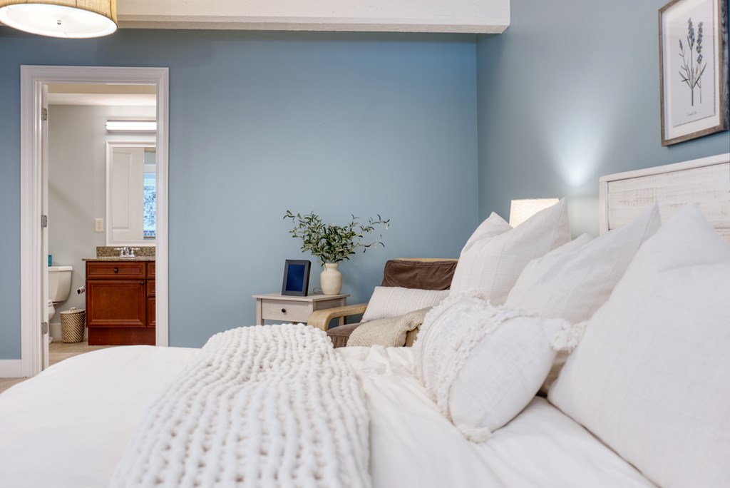 1201 Front Avenue, Unit 522 Columbus, GA 31901 - Photo 26 of 56 a bedroom with a bed and a couch