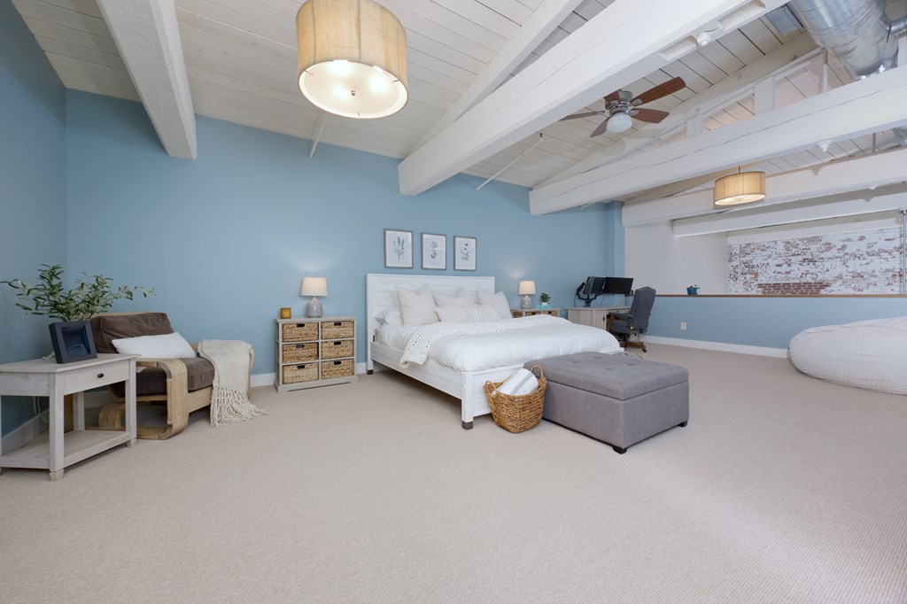 1201 Front Avenue, Unit 522 Columbus, GA 31901 - Photo 28 of 56 a living room with furniture and a chandelier