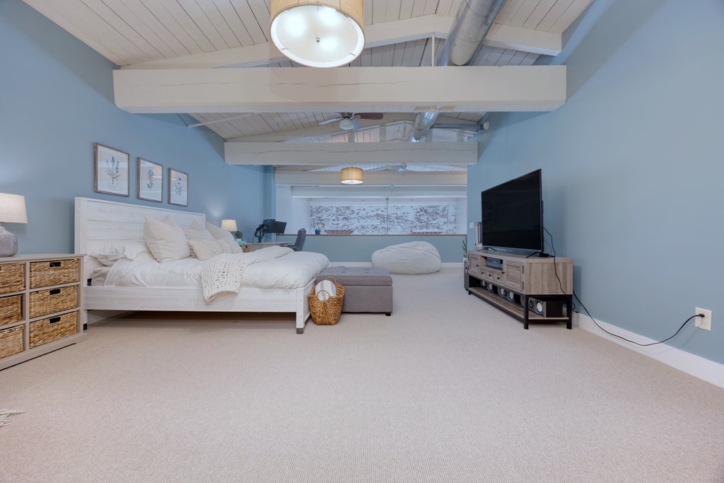 1201 Front Avenue, Unit 522 Columbus, GA 31901 - Photo 30 of 56 a living room with furniture and a flat screen tv