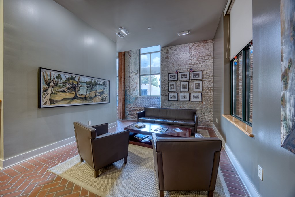 1201 Front Avenue, Unit 522 Columbus, GA 31901 - Photo 31 of 56 a living room with furniture a piano and a window
