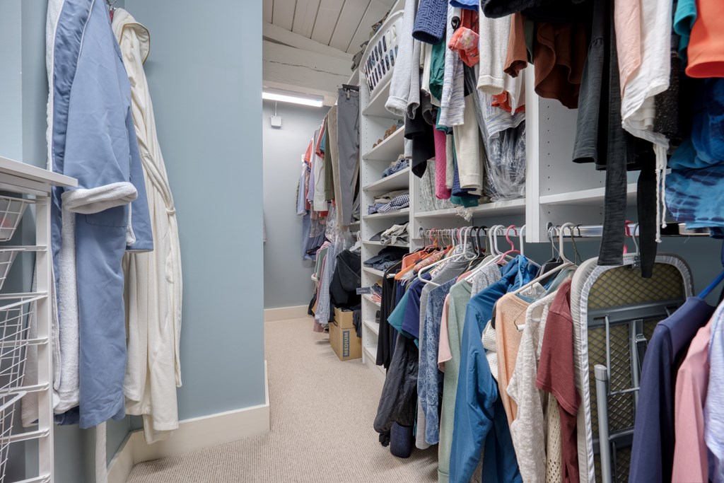1201 Front Avenue, Unit 522 Columbus, GA 31901 - Photo 43 of 56 a view of walk in closet with clothes and shoes