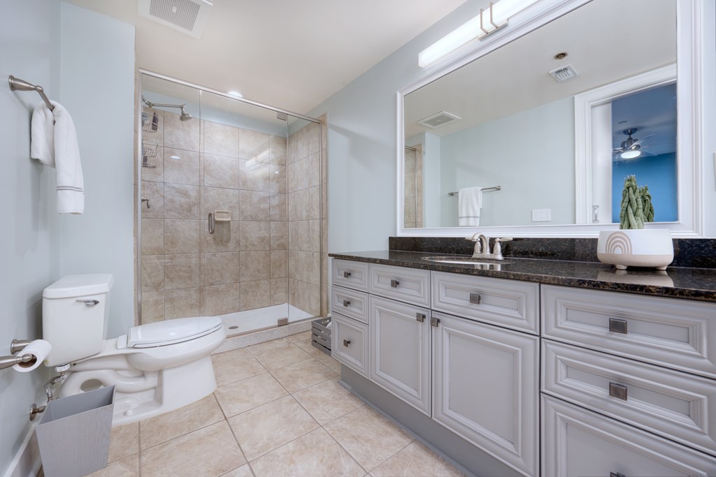 1201 Front Avenue, Unit 522 Columbus, GA 31901 - Photo 47 of 56 a bathroom with a double vanity sink toilet and shower