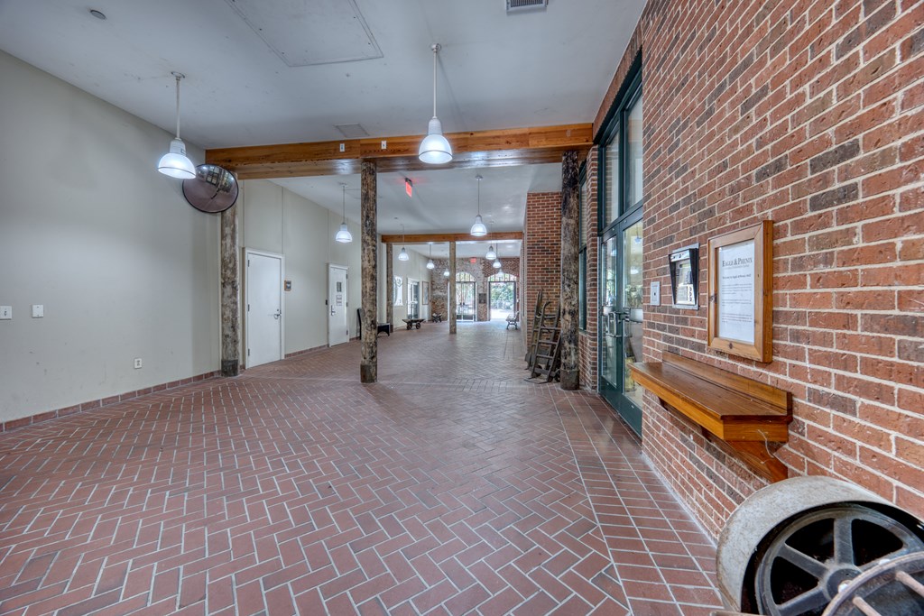 1201 Front Avenue, Unit 522 Columbus, GA 31901 - Photo 53 of 56 a view of a porch with wooden floor and a fireplace