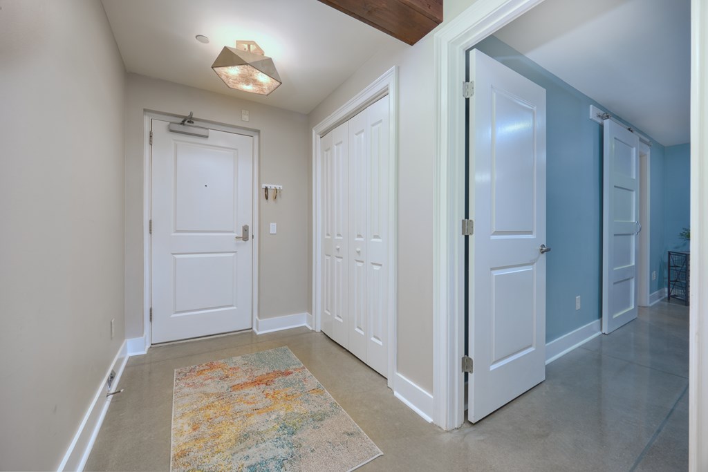 1201 Front Avenue, Unit 522 Columbus, GA 31901 - Photo 6 of 56 an empty room with closet and a chandelier fan