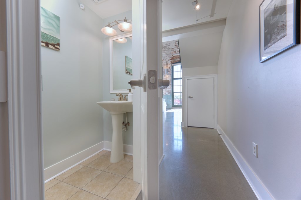 1201 Front Avenue, Unit 522 Columbus, GA 31901 - Photo 7 of 56 a view of a hallway with wooden floor