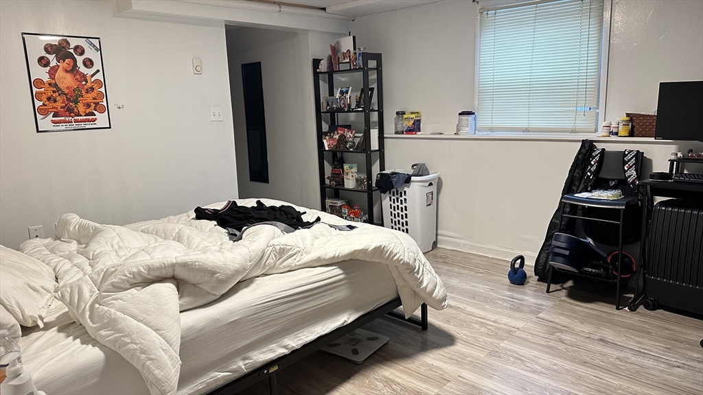 46-48 Buckley Street Quincy, MA 02169 - Photo 20 of 42 a bedroom with a bed and a book shelf